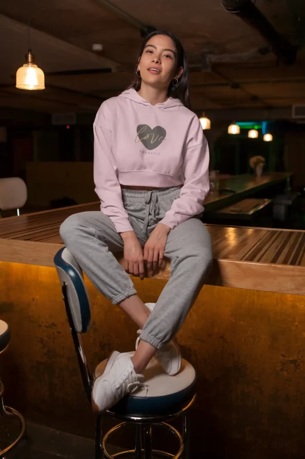 crop-top-hoodie-mockup-featuring-a-woman-sitting-over-a-wooden-bar-26103 (7)